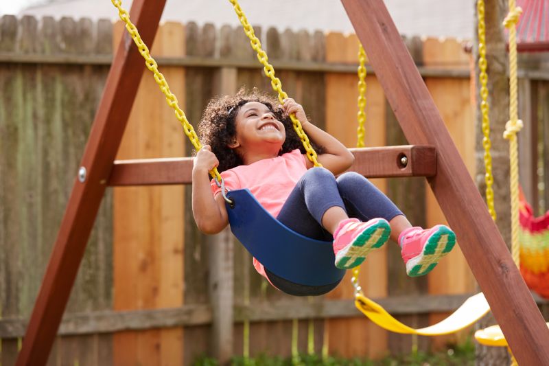 Children Playing on New Swing Set